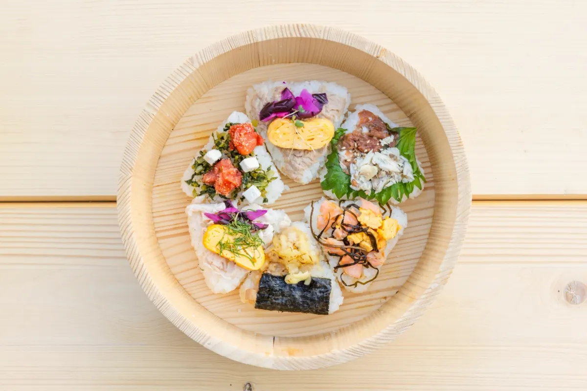 Onigiri from Ikoi Stand Onigiri & Coffee Kyobashi piled in a wooden tub